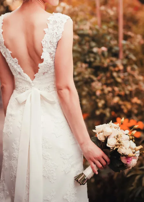 beautiful colorful wedding bouquet in a hand of a bride