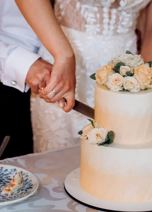 wedding decor with cake on a wooden bench against a waterfall background